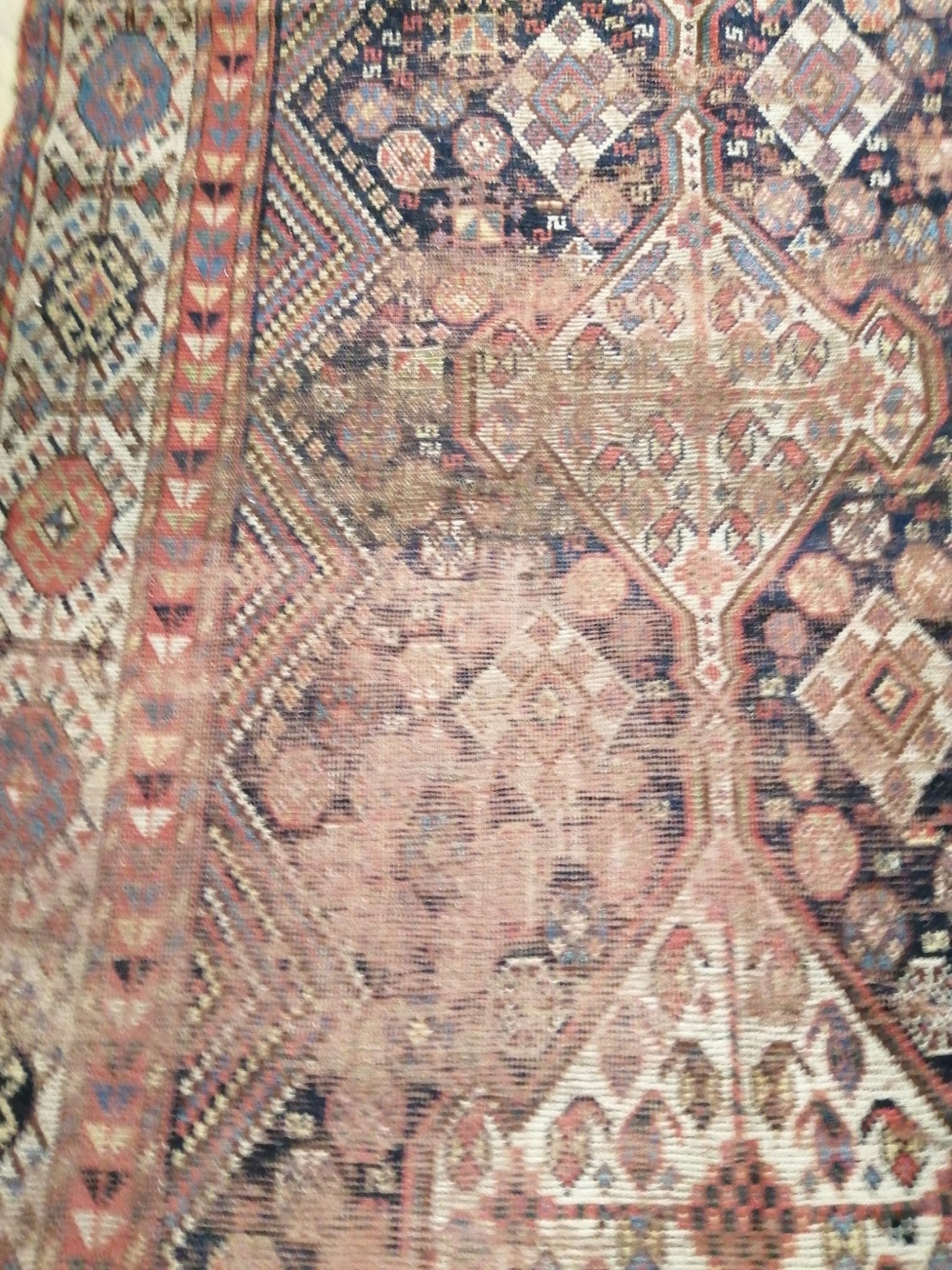 An antique Khamseh rug, 290 x 136cm